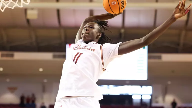 Chol Machot dunks the basketball