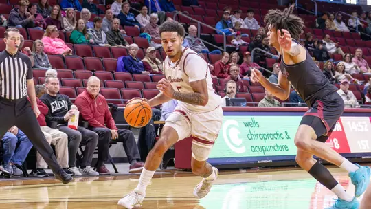 Martin Kalu dribble sthe basketball