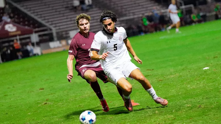 Federico Bellisi battles a defender