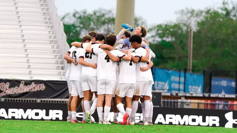Men's soccer huddle