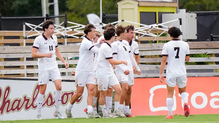 men's soccer celebratory huddle