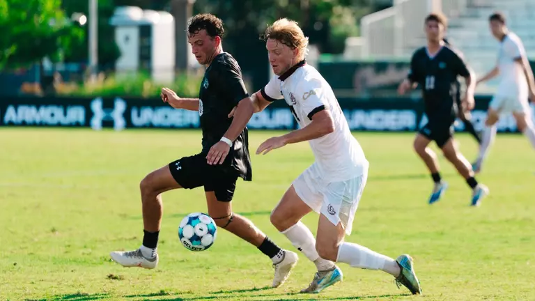 Paul Kileen battles a defender