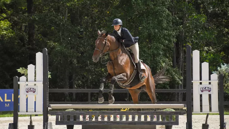 Meredith Miramonti jumps on her horse