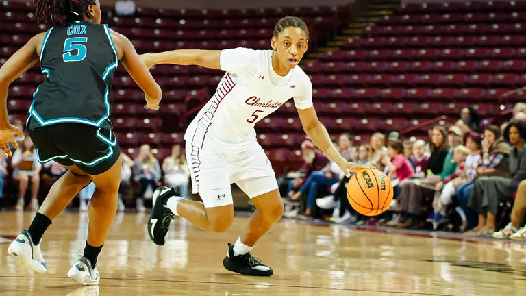 Taryn Barbot dribbles by defender