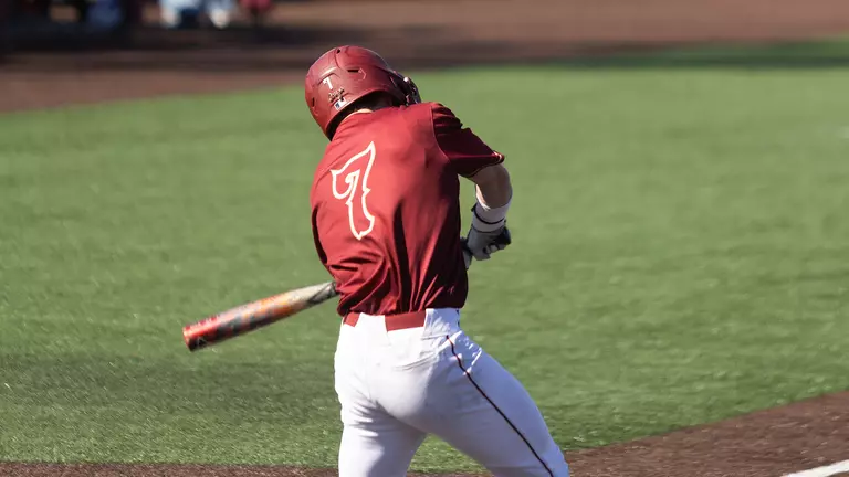 Jackson Berini swinging at a pitch.