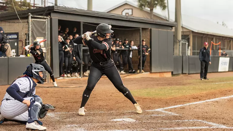 Hailey Seymour at bat ready to swing