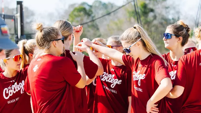 Beach Volleyball huddle at practice