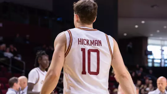 Connor Hickman walks to team bench