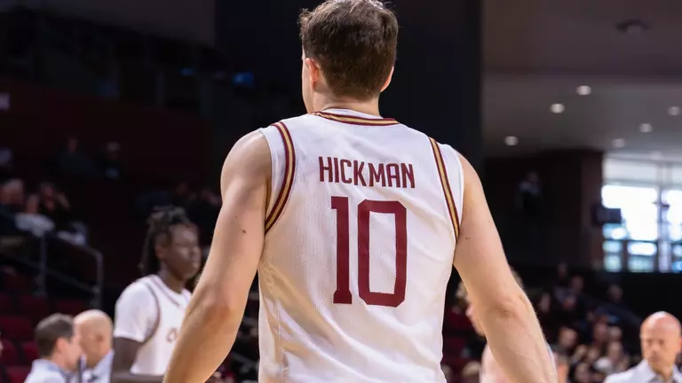 Connor Hickman walks to team bench