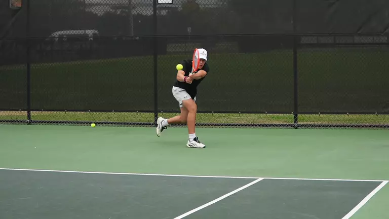 Jordy Larke returns ball