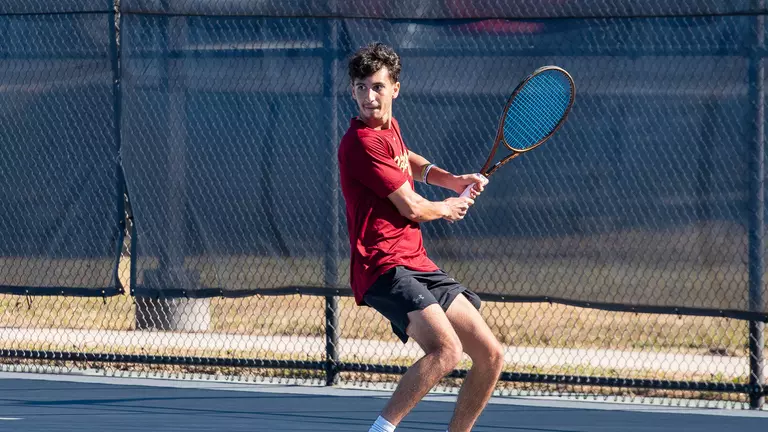 Dani Farran prepares to hit tennis ball
