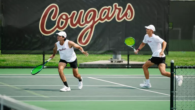 Juan Diego Rojas Mora and Leon Harder rally during a point