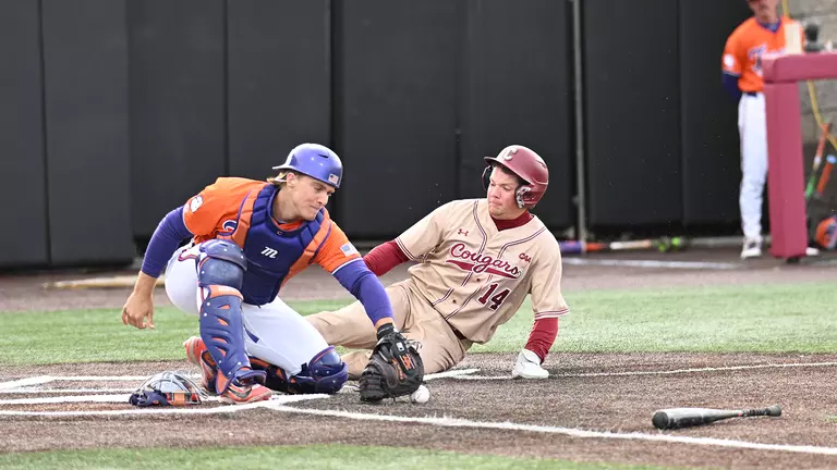 Stow Rogers sliding into the plate March 17, 2026 against UNCW.