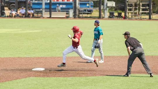 Jake Amman rounding second base March 22, 2026 vs UNCW.