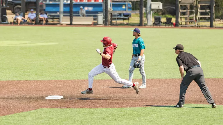 Jake Amman rounding second base March 22, 2026 vs UNCW.