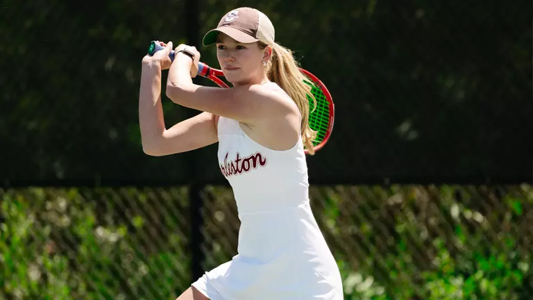 Saige Severance hits tennis ball