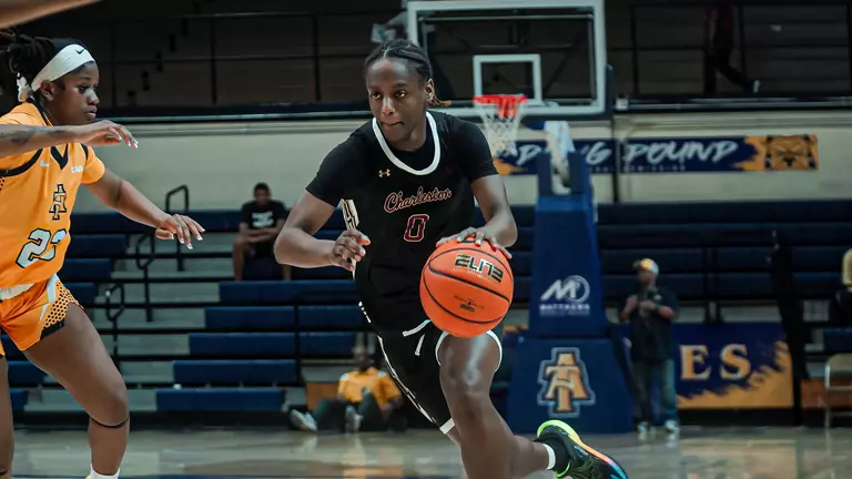 Taylor Barbot dribbles ball up the court