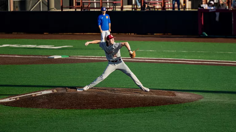 Carter Harrington throwing a pitch against UNCW.