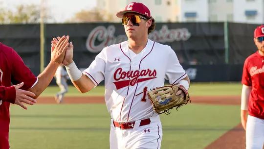 Stow Rogers giving a high five to a teammate.