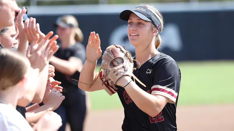 Audri Bates high fiving her teammates