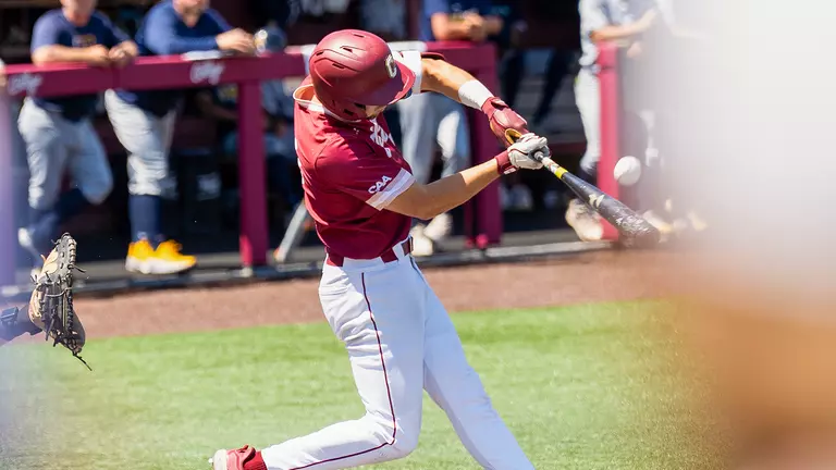 Will Tippett swinging a bat at Patriots Point.