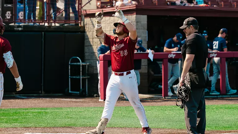 Landon Penfield celebrating a home run at Patriots Point.