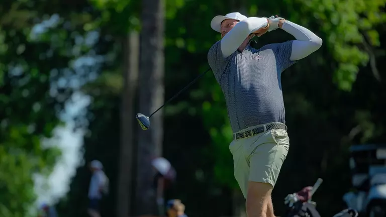 Nevill Ruiter swings the club