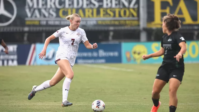 Mary Martin Spinner running down field with the ball