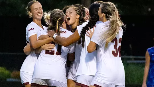 Women's Soccer celebrating goal