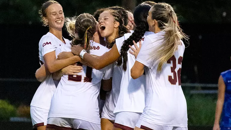 Women's Soccer celebrating goal