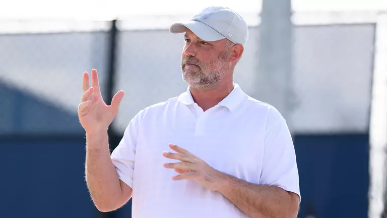 Ryan Rasco coaching tennis
