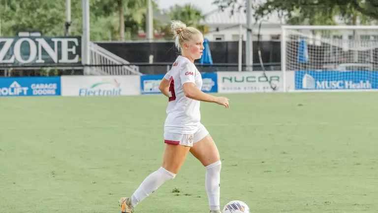 Lyla Schick kicking the ball