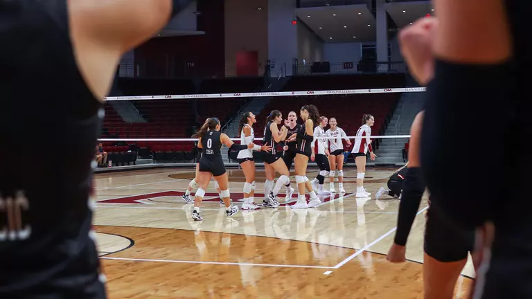 Charleston volleyball celebrating a 3-0 win at Elon Sept. 19.