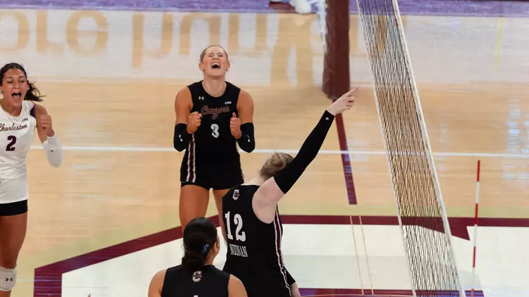Julia Gnida and Caroline Noonan celebrating a Charleston point.