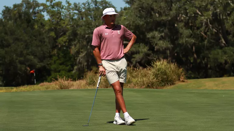 Johan Bredenkamp looking at a hole on the green.