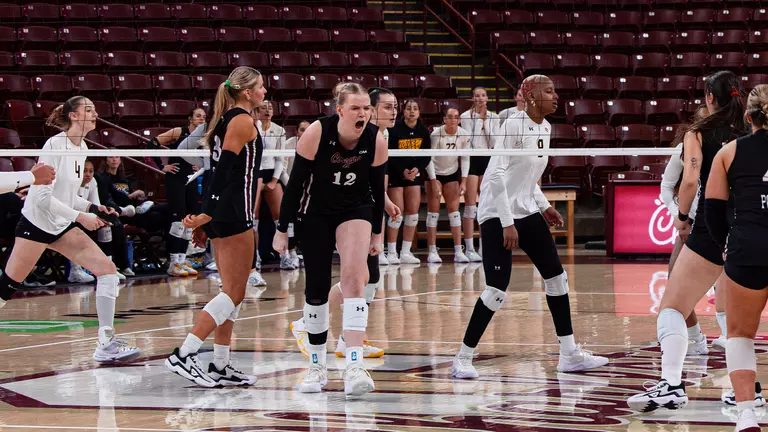 Caroline Noonan celebrating a point against Towson.