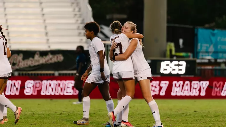 Mary Martin Spinner hugging Chloe Nelson