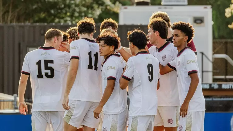 Men's soccer team huddle