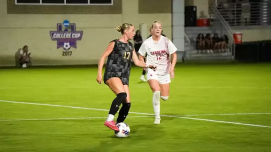 Kassy Uzelman dribbling the ball