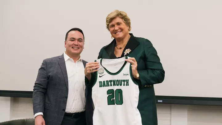 Mike Harrity with Gail Koziara Boudreaux '82 and her jersey