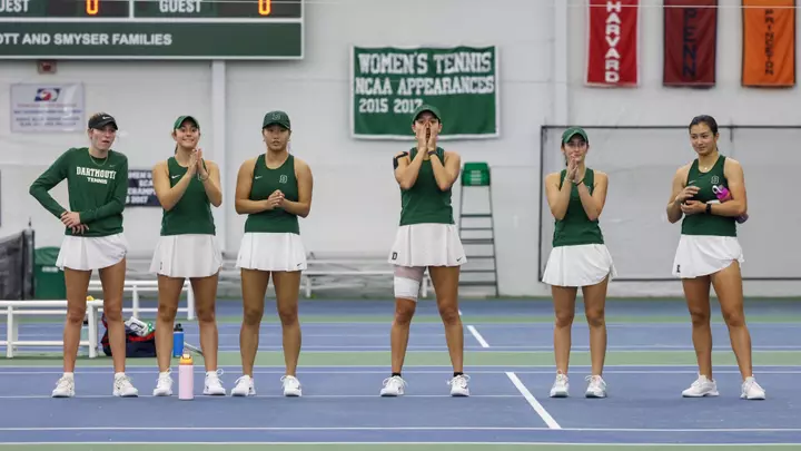 Women's tennis cheers on the team