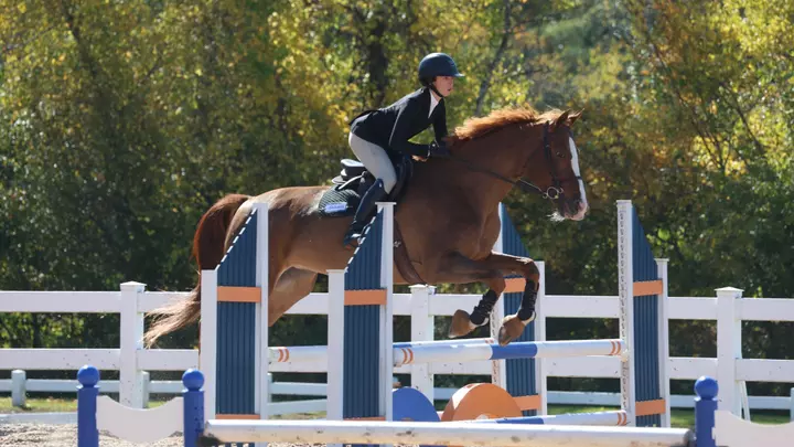 Elise Stephens jumps at home vs SU