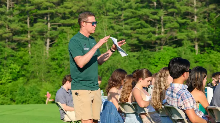 Mike Nelson speaks to his team