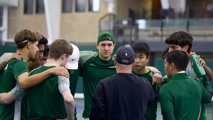 Men's tennis huddle at home