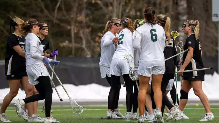 WLAX celebrates a goal vs Bryant
