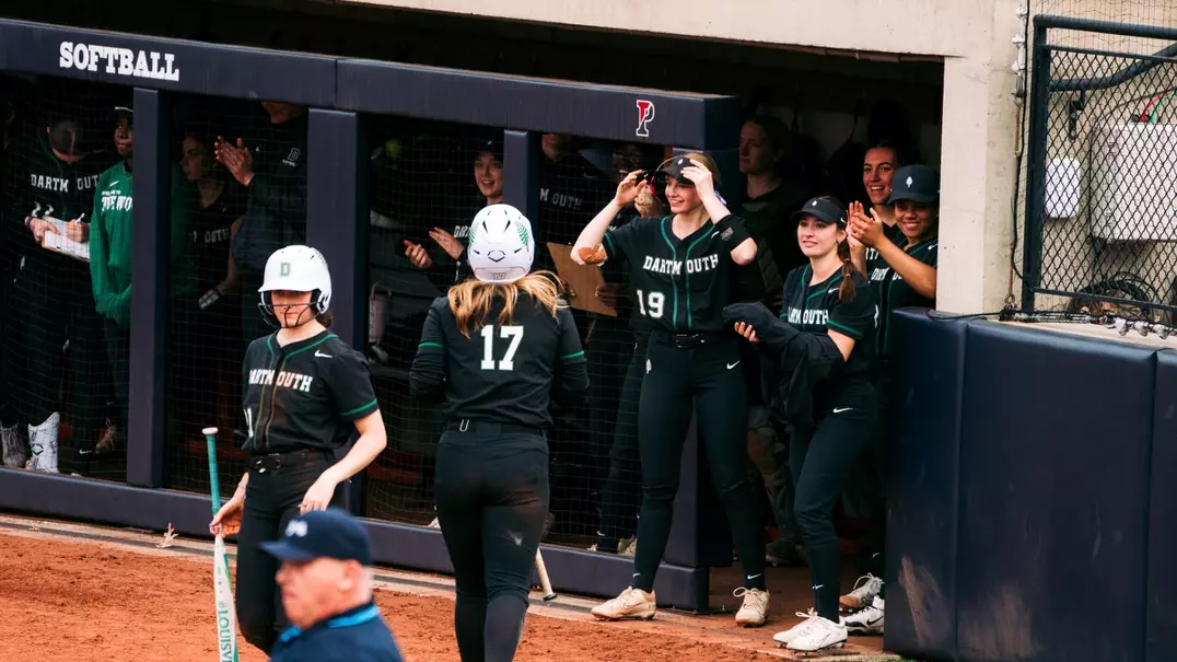 Softball celebrating in dugout