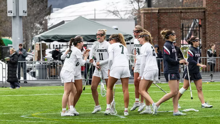 DWLAX celebrates a goal vs Penn