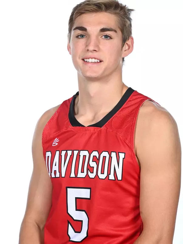 Teams pose for media photos during team media day at Belk Arena on Monday, October 18, 2021 in Davidson, North Carolina.