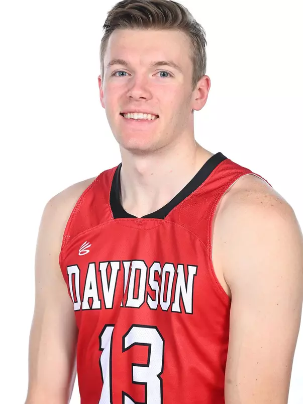 Teams pose for media photos during team media day at Belk Arena on Monday, October 18, 2021 in Davidson, North Carolina.
