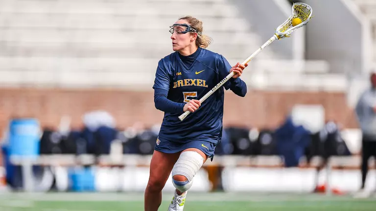 Late Goals Lifts Quakers Past Dragons, 11-10